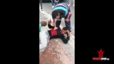 Theif gets a community beating.