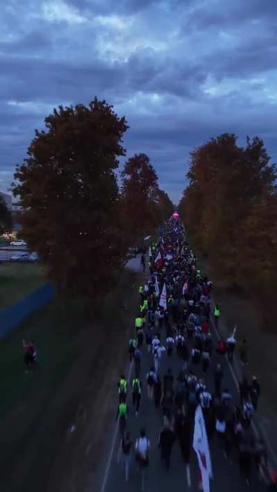 Thousands of Serbian students are marching 100 km on foot to Novi Sad to commemorate the deaths of 16 people who were killed when the train station collapsed on them on November 1st, 2024. They are also demanding accountability from the officials who appr