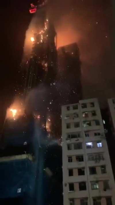 Under construction skyscraper on fire in Hong Kong