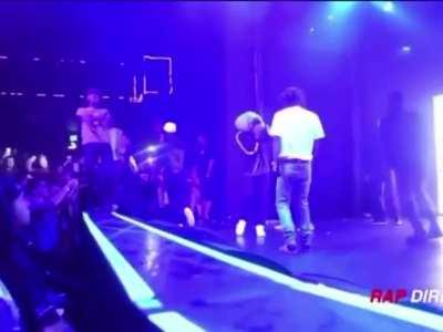 TBT to when a fan almost perfectly landed a bottle flip on top of Uzi’s head while he was on stage💀