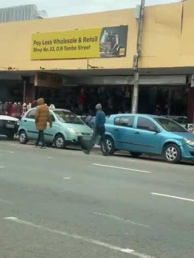 A man protecting his family against degenerate hyenas In South Africa.