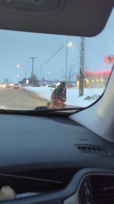 Man on mobility scooter driving in traffic