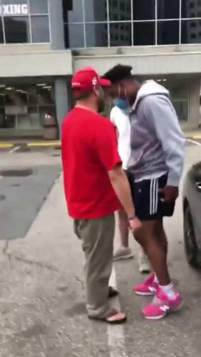 Man in MAGA hat gets aggressive with some kids over covid masks.