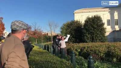 Man tries to evade police by running into a garden and is quickly apprehended - Washington, DC 14th November