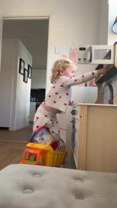 Just playing in her kitchen