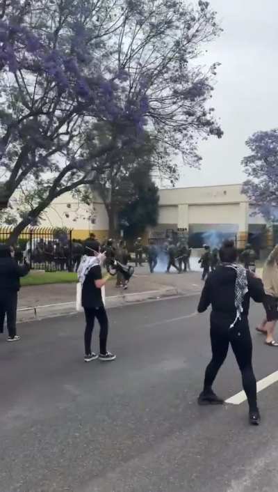Federal agents/ICE using crowd control munitions on community members outside of the Home Depot in Paramount, CA after a nearby raid