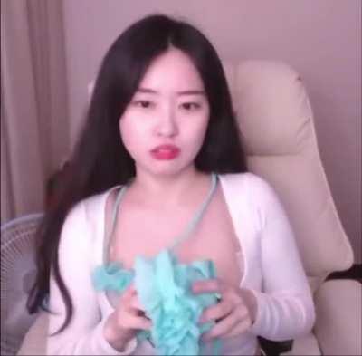 Soram removing her bra