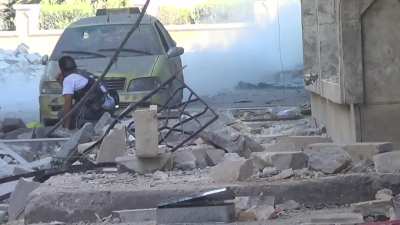 FSA Northern Storm Brigade fighter absolutely whiffs on the toss of an improvised grenade - Aleppo - 9/17/2012