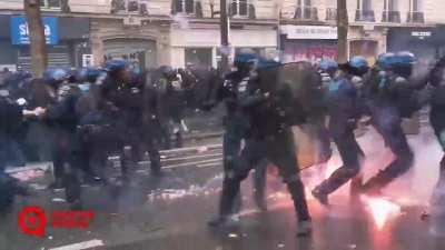 Police getting hit by firebombs in Paris today