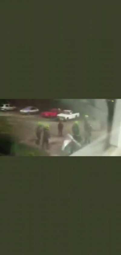 Policemen admitting throwing protestors on the Cauca River while harassing a home.