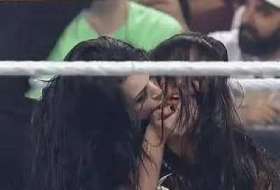 Paige gives AJ a kiss