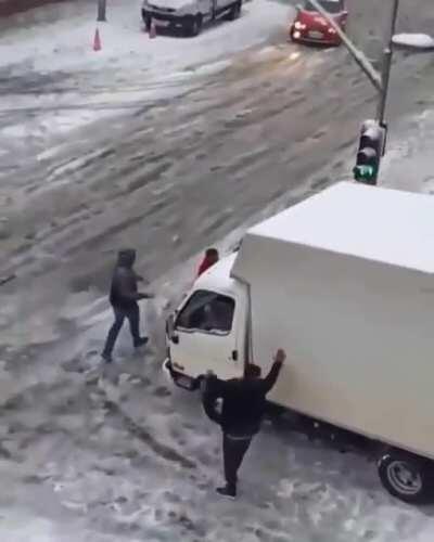 People helped vehicles slide on ice to stop