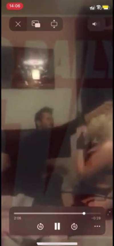 Andrew Tate hitting a woman on video with a belt and open hand slap