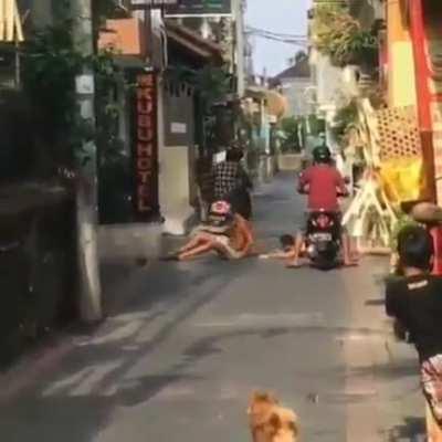 Humans blocking off a road