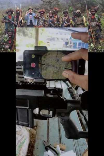 Indonesian Army when The West Papua National Liberation Army posing for photos with their hostage