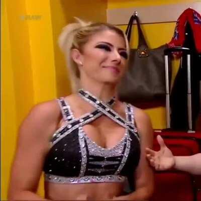 Pressing her tits together.