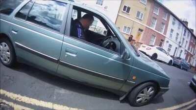 Angry driver chases after the person who took video of his reckless driving, and gets what he deserves