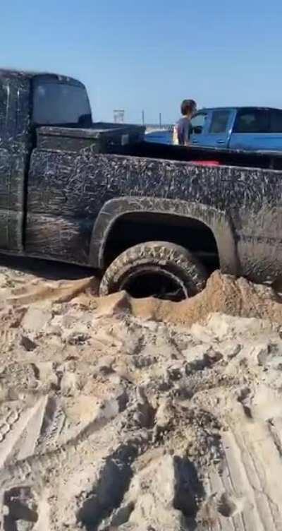 WCGW Driving a truck on the beach and using another truck to get it out. (third truck also got stuck)