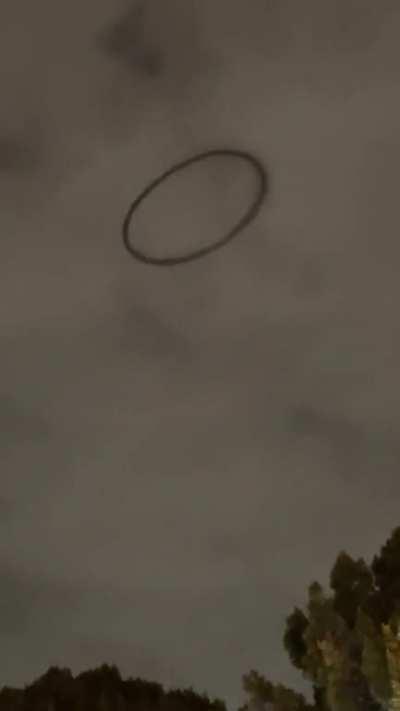Black ring in the sky floating over Disneyland in California.