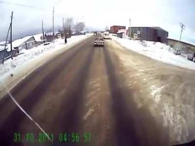 Woman runs into pedestrian crossing in front of a speeding truck(Krasnoufimsk, Russia)