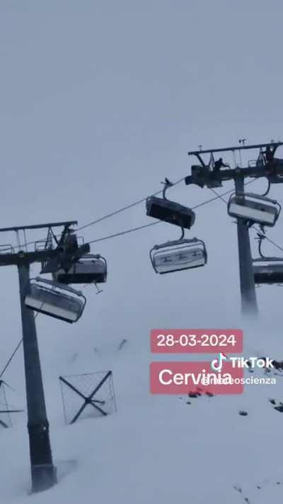 Wind started blowing at 100km/h (62 miles/h) in Cervinia, Italy. You can see people on the top right ski lift