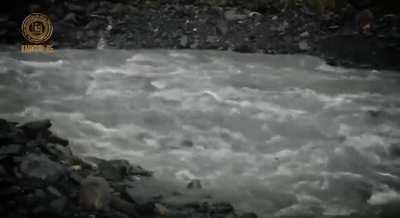 RU pov - Kadyrov, leader of Chechnya and Chechen troops in Ukraine, makes a video where he runs and shoots a machine gun at the sky, while SUVs circle him