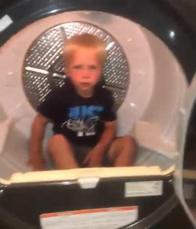 Kid gets in tumbledryer - parents call his bluff