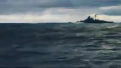 Battleship Bismarck firing at HMS Hood during the Battle of the Denmark Strait.