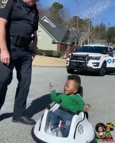 Young boy is stopped by a cop for speeding.
