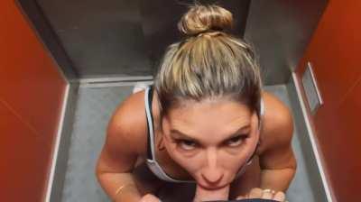 Gagging on his big cock in the elevator