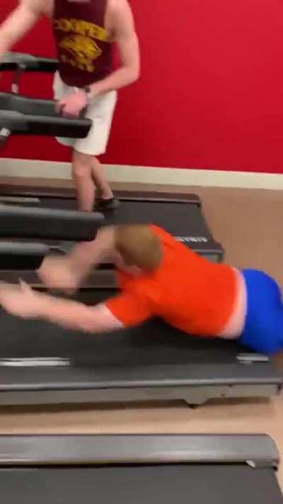 Kid takes on moving treadmill, treadmill wins