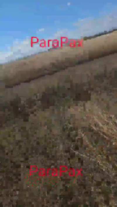 Russian soldier attempts to shot down an incoming Ukrainian kamikaze drone. Fall 2025, location unknown