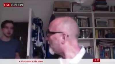 Adorable moment man interrupted by his son on live TV