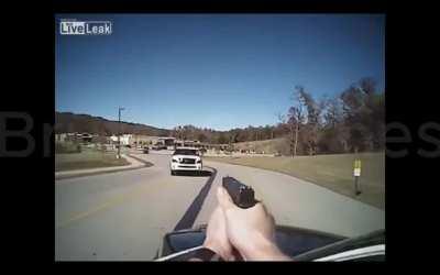 why is there a giant suv going right towards a cop??? 