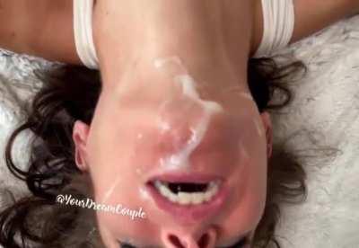 Head hanging over the bed getting the last few drops!