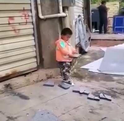 At the moment, he is practicing Iron Head Kung Fu.