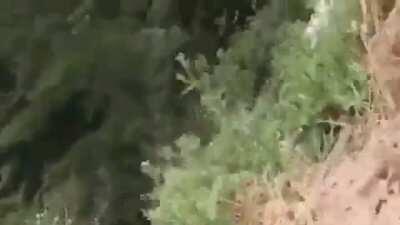 Somebody built a dirtbike track right next to a cliff!