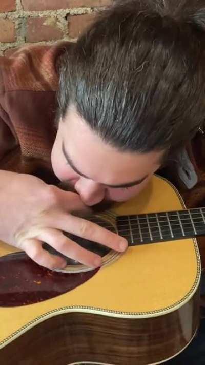 Use a condom to make your guitar sound like a banjo
