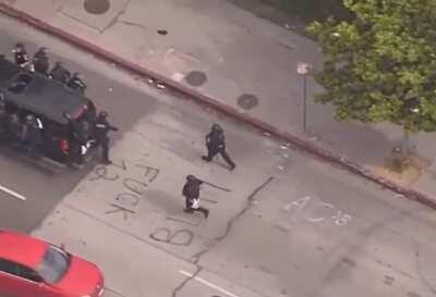 LAPD falls off their vehicle during protest