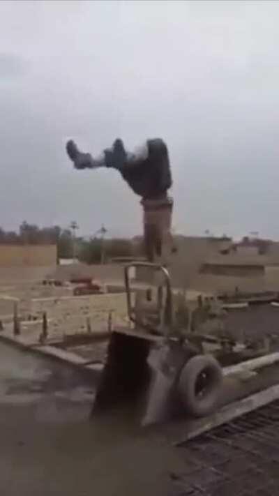 Worker flips pouring heavy load