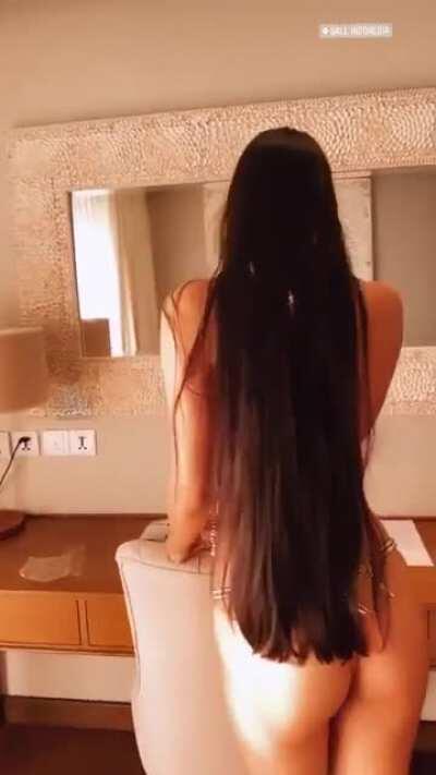 Checking her assets in the mirror (GIF)