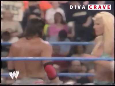 Torrie Wilson kissing Billy Kidman on screen