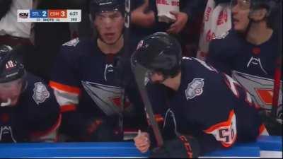 Jordan Binnington slowly lays on top of Connor McDavid.