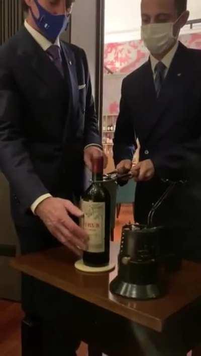 How to open a $7,000 Chateau Petrus wine bottle.