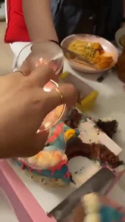 Cutting the cake like a normal human being was not an option