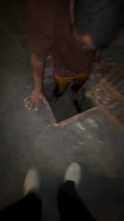 Man rescued a baby bird from manhole