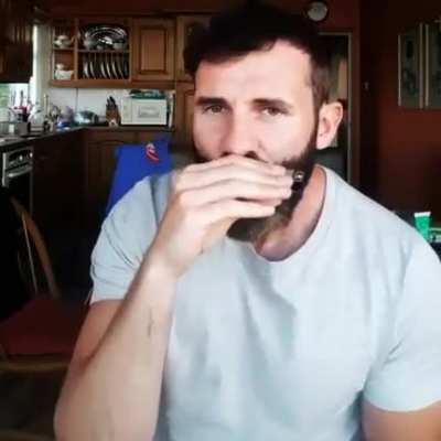 Guy beatboxing on a harmonica