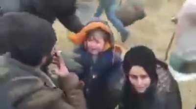Photographer blows smoke in the face of a child in order to get a good shot of him crying for some unknown fucking reason