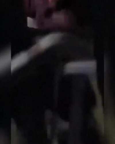 Man playing around with a metal door