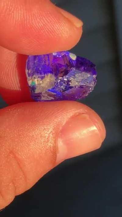 Natural blue tanzanite ready for cutting .